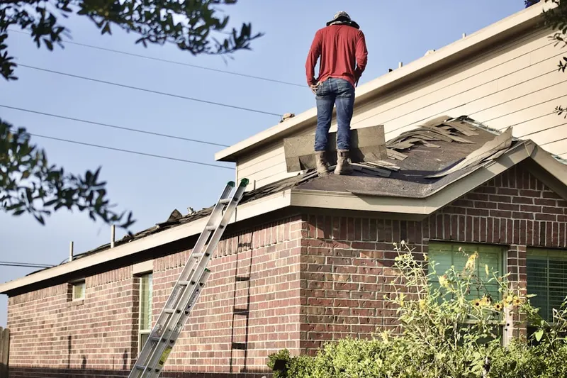 Professional roofer working on a residential roof in Westlake Village